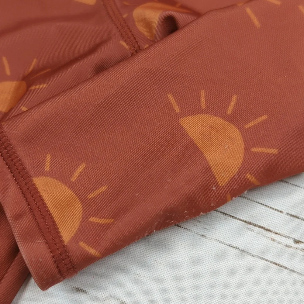 Kids Rust Orange Sun Print One-Piece Swimsuit - Long Sleeve